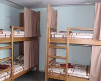 Кровать в женском шестиместном номере на двухъярусной кровати (общие удобства)