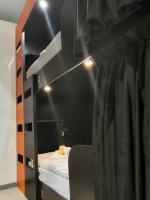 Многоместный смешанный номер Orange - Нижнее спальное место в общей 12-ти местной комнате для мужчин и женщин (6 капсул)